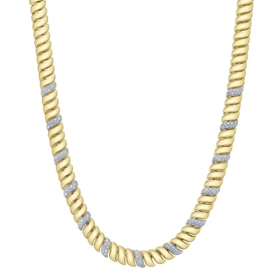 The Diamond Ribbed Necklace showcases a twisted design with alternating gold and silver sections, accented by small sparkling stones, displayed against a white background.